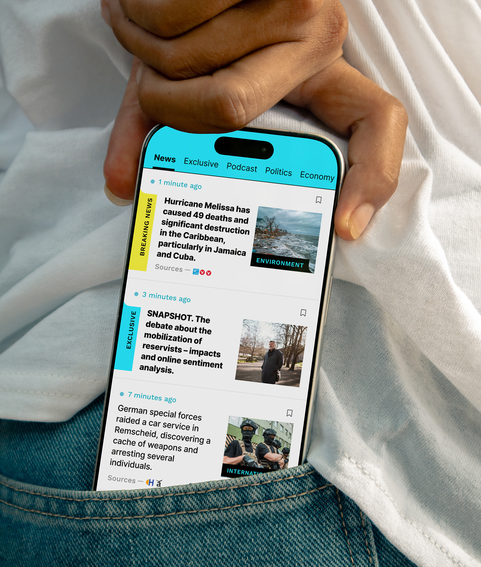 A person casually holding a smartphone with the Informat news app open in the pocket area of their jeans, designed by Quickdata, showing a live news feed with breaking stories and category tabs, demonstrating real-world mobile usability.